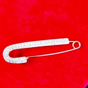 3",Gold plated w/mini rhinestones, safety pin brooch.
